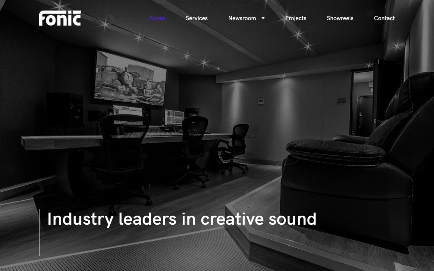 Fonic About page header: a black-and-white photo of the Dolby Atmos mixing suite, headed 'Industry leaders in creative sound'